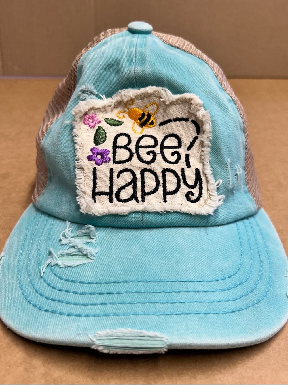 Bee Happy Ponytail Distressed Aqua Womenโs Hat C.C. Brand